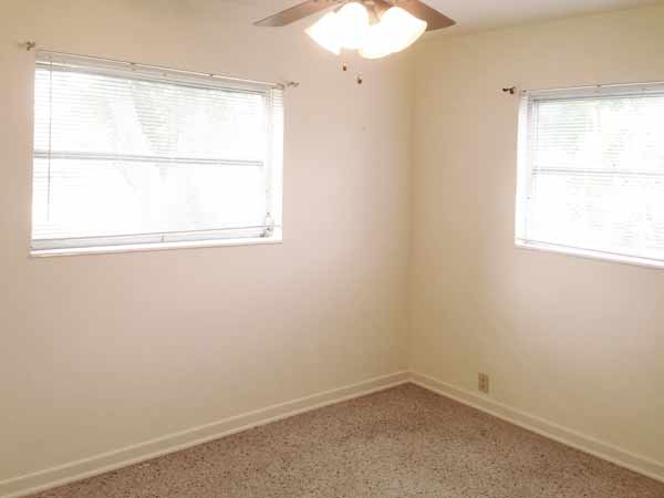 Bedroom 1 has great light with windows facing onto front yard and side yard, double door closet. Room size: 11.75' x 9'.
